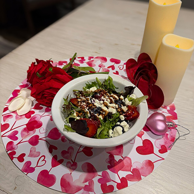 Valentine's dinner display featuring a chef-prepared salad.