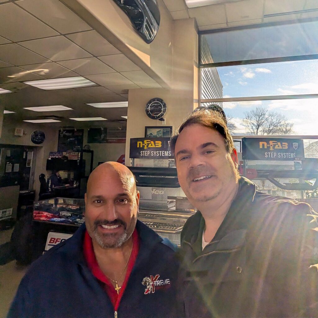 A team member from Vitalia Stow smiles with a local business owner.